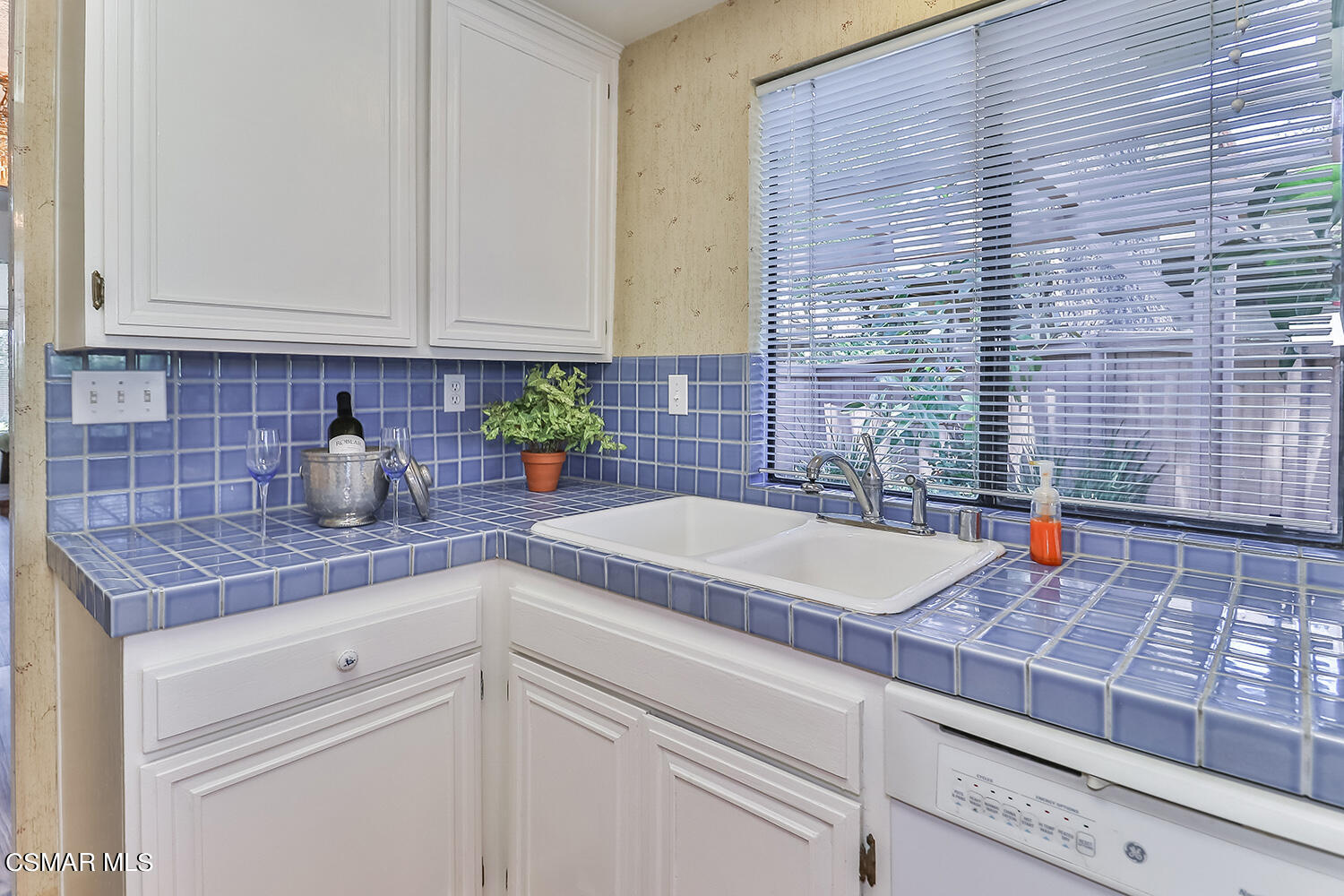 2068 Emory Avenue Simi Valley, CA 93063 - Photo 16 of 35 a kitchen with stainless steel appliances a sink dishwasher and cabinets