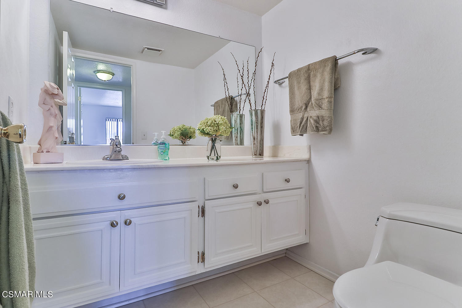 2068 Emory Avenue Simi Valley, CA 93063 - Photo 19 of 35 a bathroom with a toilet sink and mirror