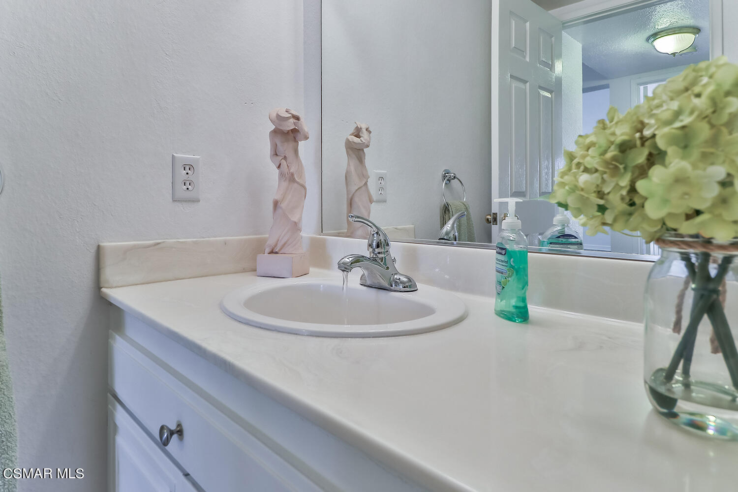 2068 Emory Avenue Simi Valley, CA 93063 - Photo 20 of 35 a bathroom with a sink and a mirror
