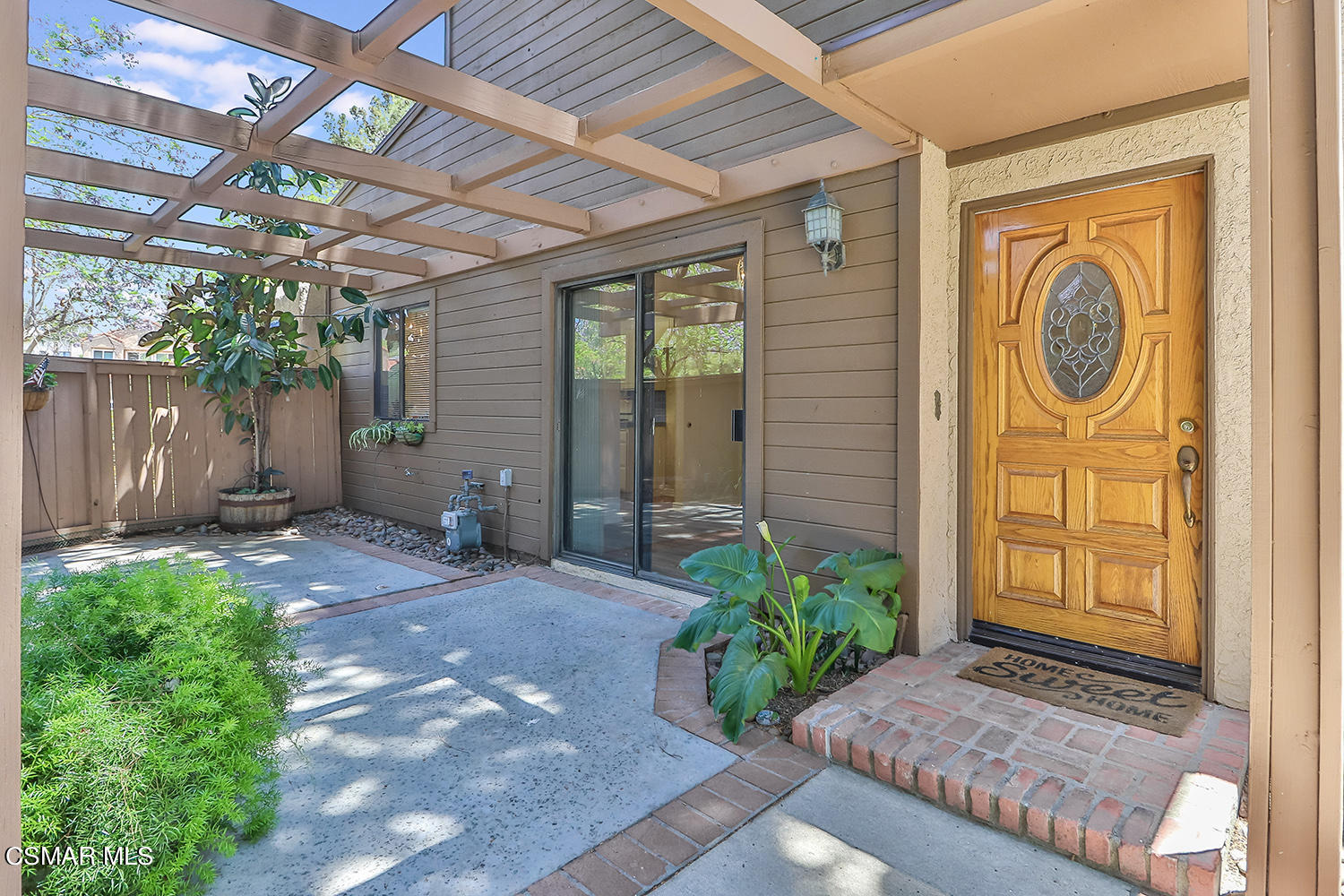 2068 Emory Avenue Simi Valley, CA 93063 - Photo 3 of 35 a front view of a house with garden