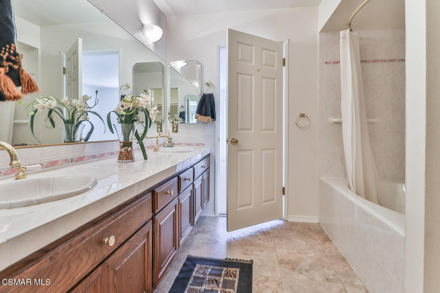 2068 Emory Avenue Simi Valley, CA 93063 - Photo 26 of 35 a bathroom with a granite countertop sink a mirror and shower