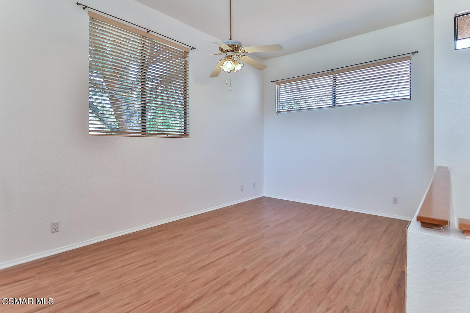 2068 Emory Avenue Simi Valley, CA 93063 - Photo 27 of 35 an empty room with wooden floor and windows