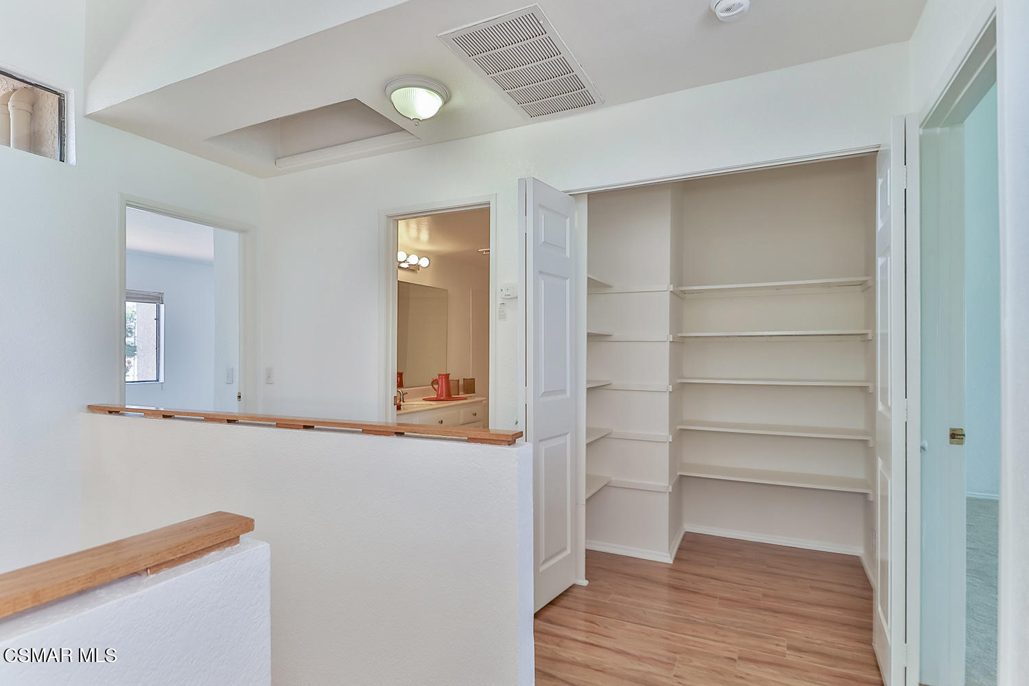 2068 Emory Avenue Simi Valley, CA 93063 - Photo 28 of 35 a view of an empty room with wooden floor and closet