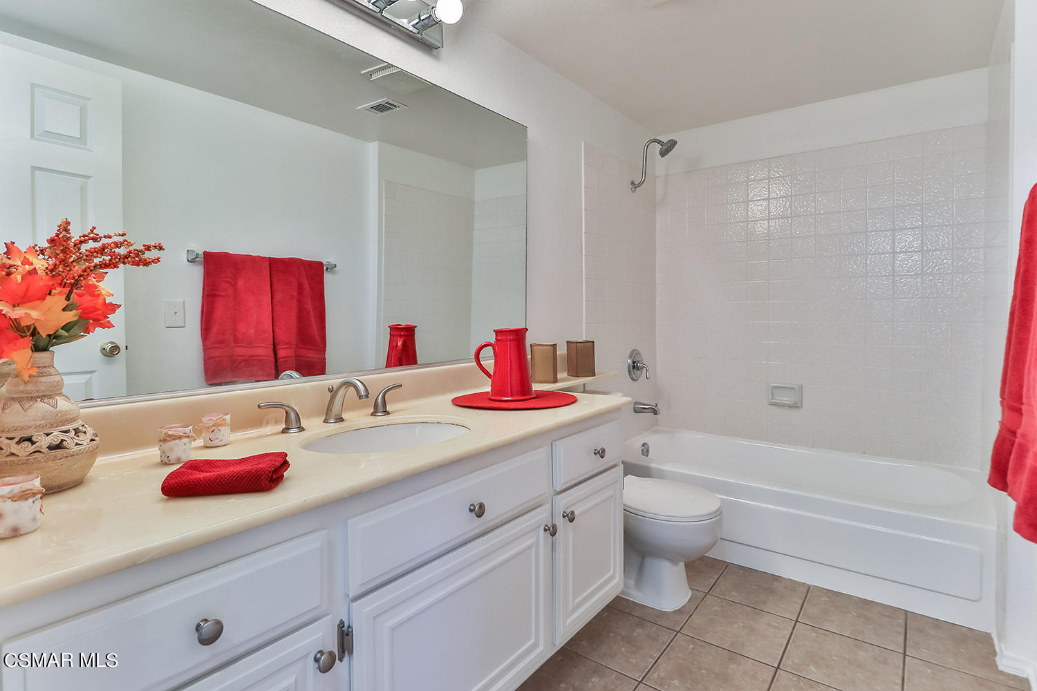2068 Emory Avenue Simi Valley, CA 93063 - Photo 30 of 35 a bathroom with a granite countertop sink mirror vanity and toilet