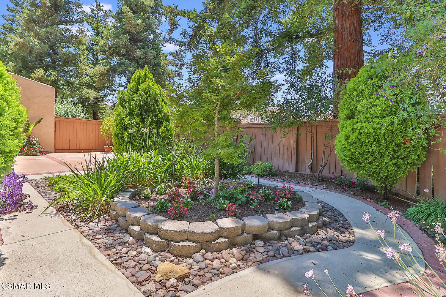 2068 Emory Avenue Simi Valley, CA 93063 - Photo 6 of 35 a view of a garden with plants and large trees