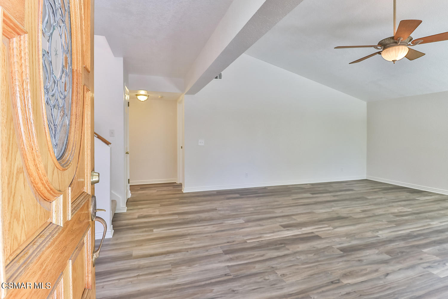 2068 Emory Avenue Simi Valley, CA 93063 - Photo 10 of 35 a view of an empty room with wooden floor and a window