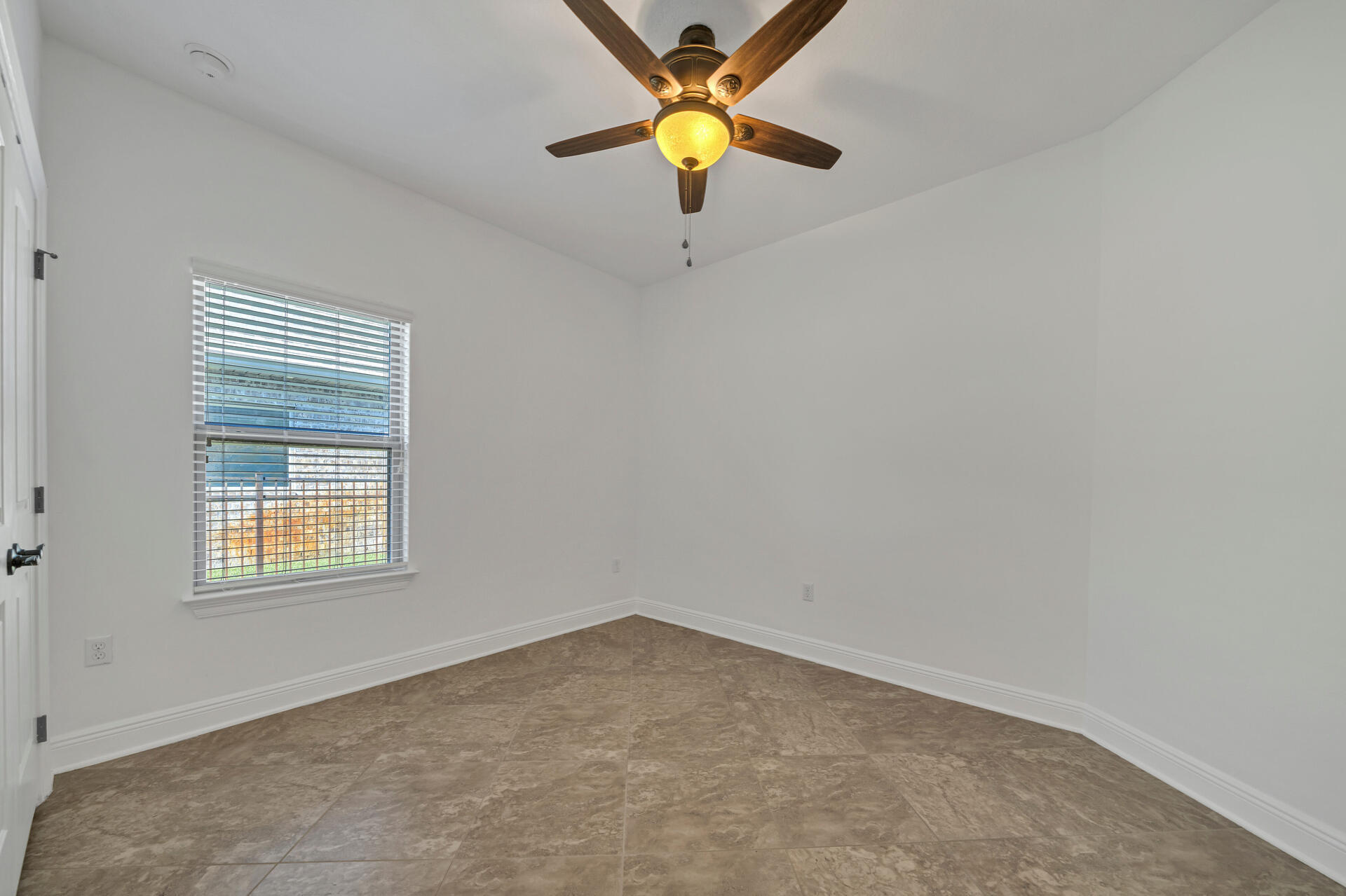 137 Lullaby Loop Santa Rosa Beach, FL 32459 - Photo 11 of 33 an empty room with a window and a ceiling fan
