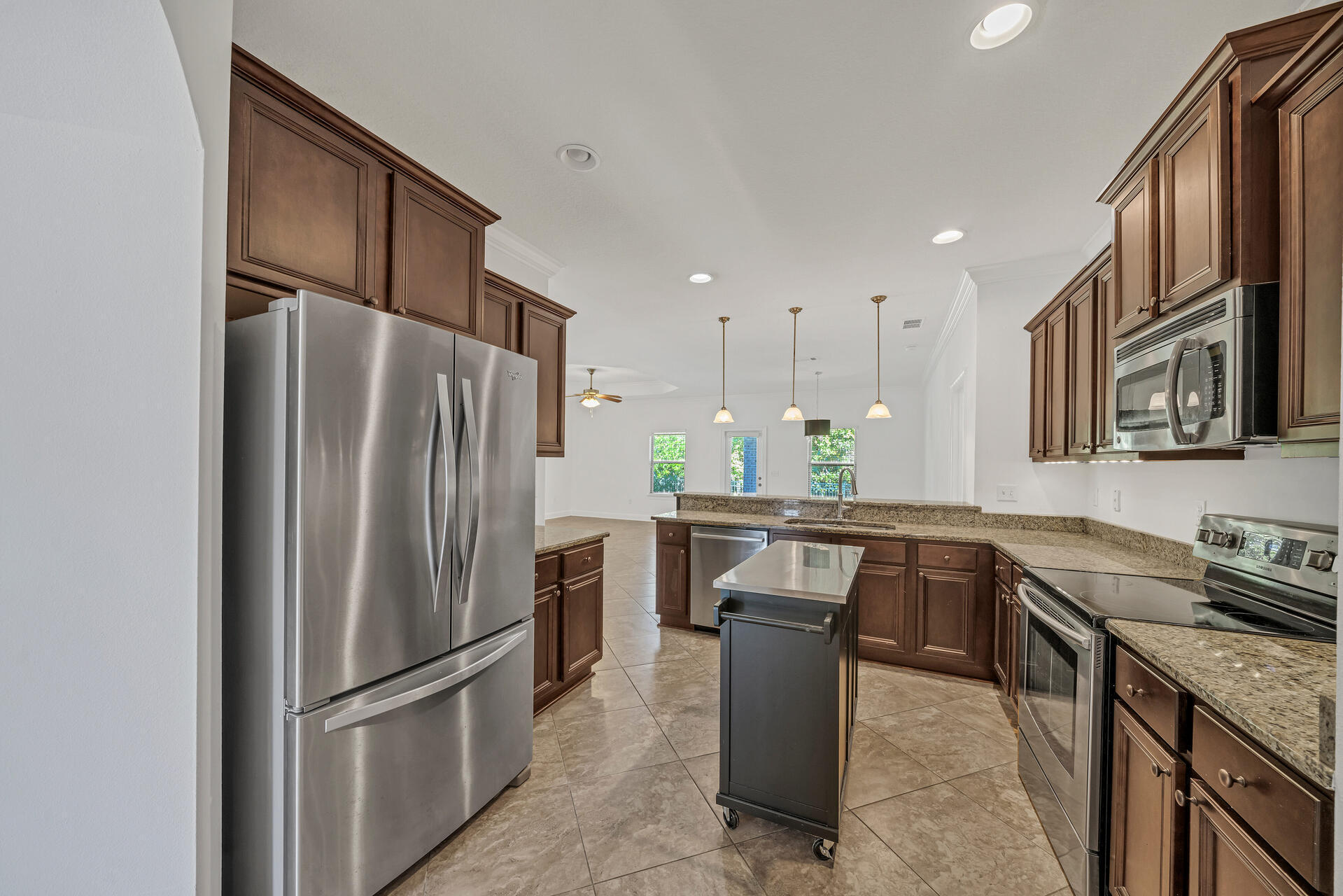 137 Lullaby Loop Santa Rosa Beach, FL 32459 - Photo 13 of 33 a kitchen with refrigerator and cabinets