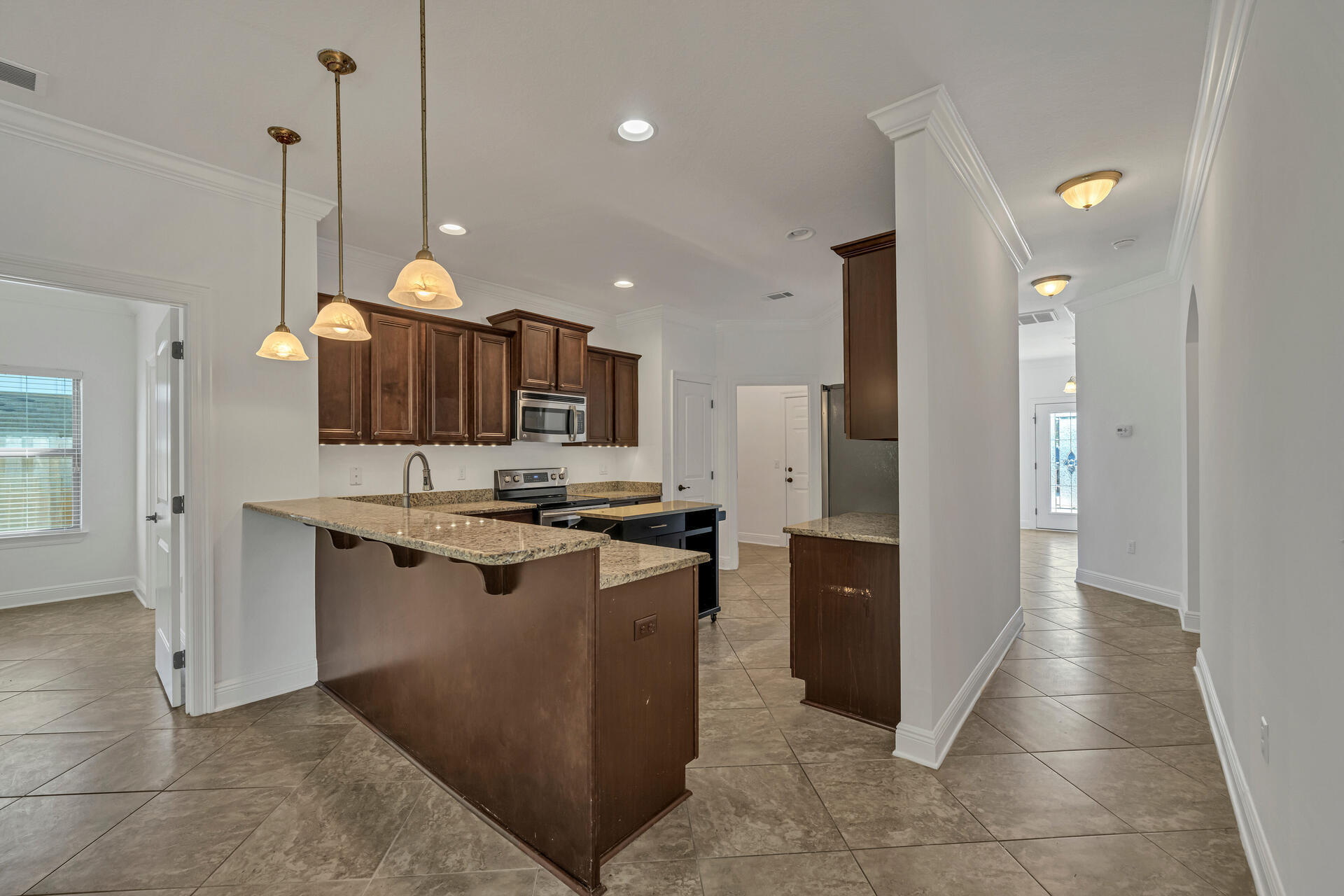137 Lullaby Loop Santa Rosa Beach, FL 32459 - Photo 15 of 33 a kitchen with stainless steel appliances granite countertop a sink and a stove