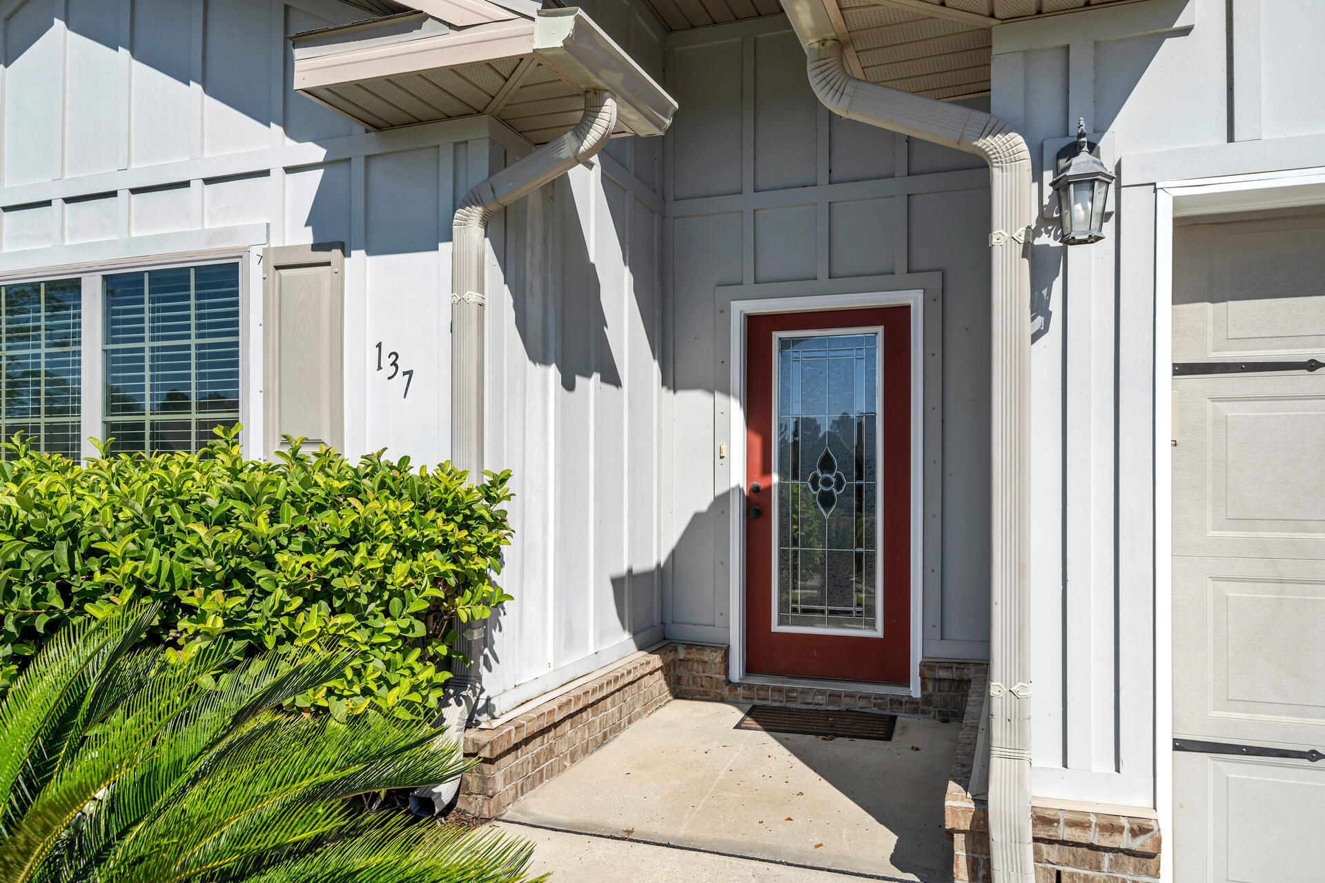 137 Lullaby Loop Santa Rosa Beach, FL 32459 - Photo 2 of 33 a front view of a house with a garage