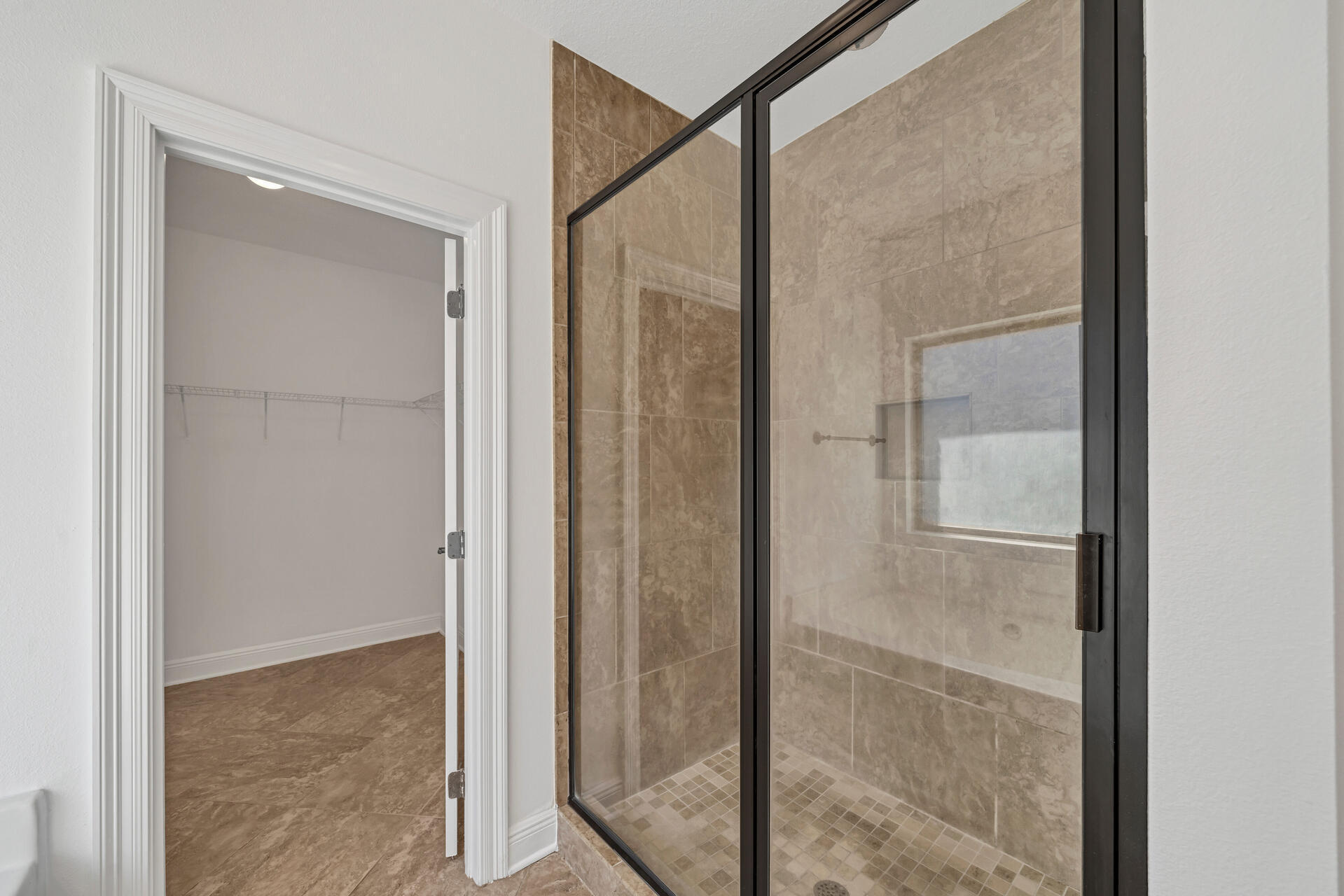 137 Lullaby Loop Santa Rosa Beach, FL 32459 - Photo 24 of 33 a bathroom with a glass shower door
