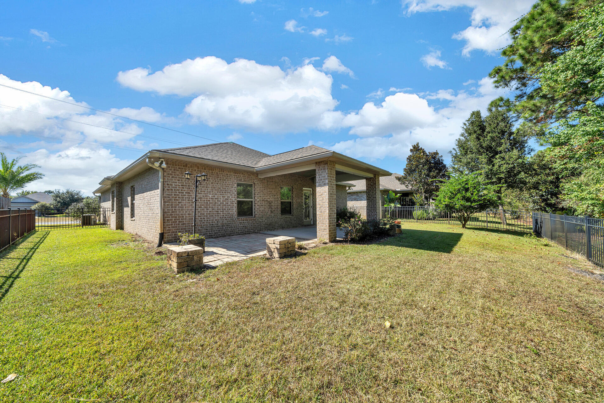137 Lullaby Loop Santa Rosa Beach, FL 32459 - Photo 31 of 33 a house view with a sitting space and garden space