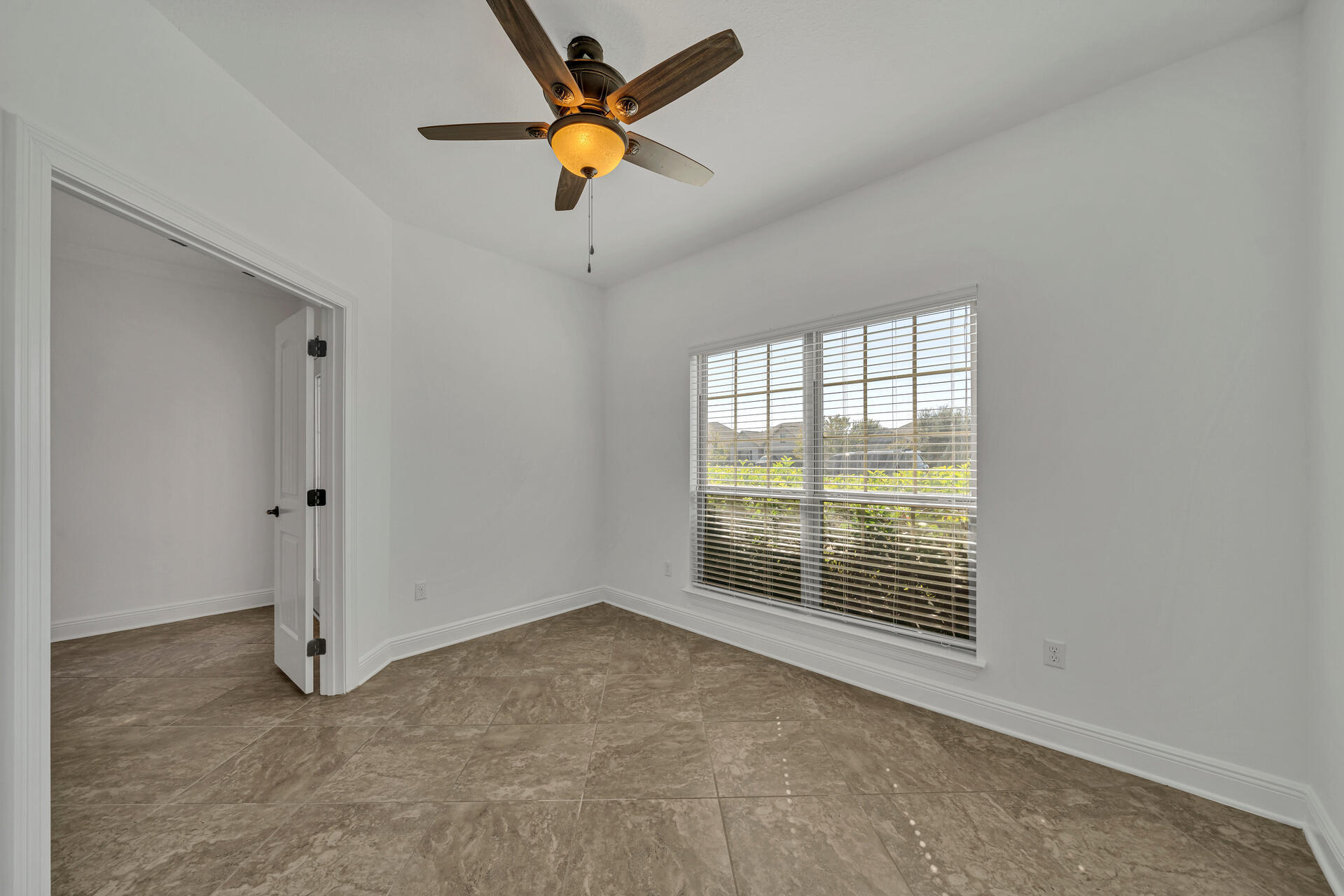 137 Lullaby Loop Santa Rosa Beach, FL 32459 - Photo 9 of 33 an empty room with a window and ceiling fan