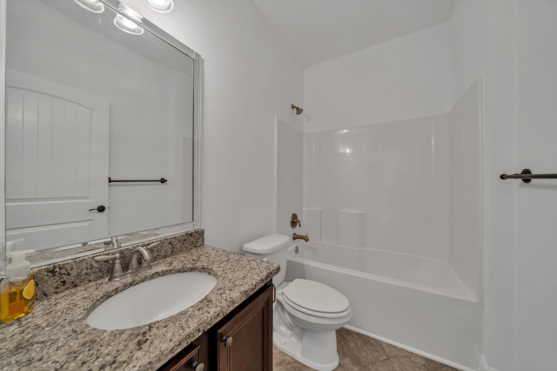 137 Lullaby Loop Santa Rosa Beach, FL 32459 - Photo 10 of 33 a bathroom with a granite countertop sink toilet and shower
