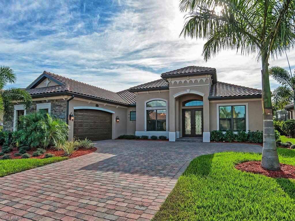 9634 Firenze Circle Naples, FL 34113 - Photo 2 of 35 front view of a house with a yard