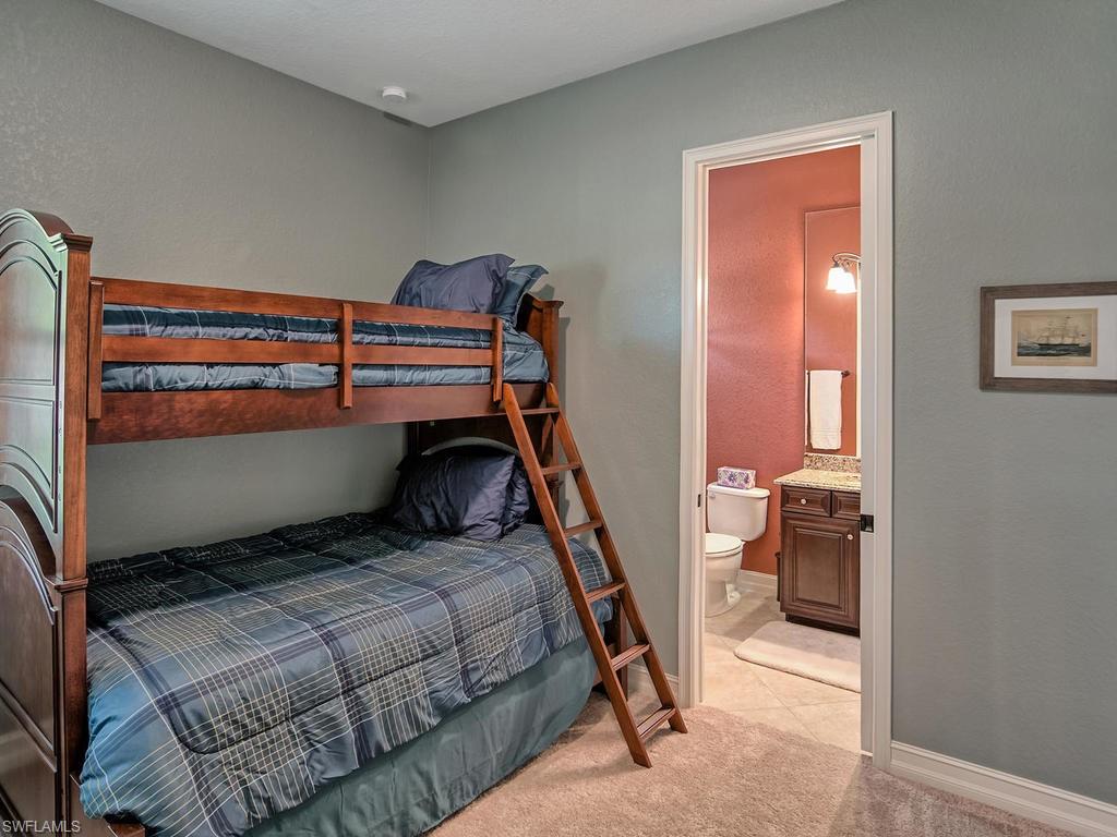 9634 Firenze Circle Naples, FL 34113 - Photo 21 of 35 a bedroom with a bed and a window