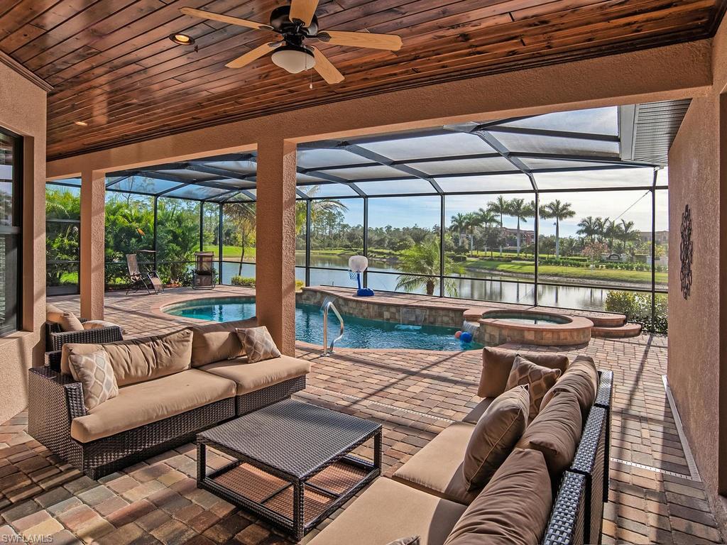 9634 Firenze Circle Naples, FL 34113 - Photo 23 of 35 a living room with furniture and a floor to ceiling window