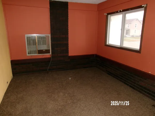 a view of an empty room and window