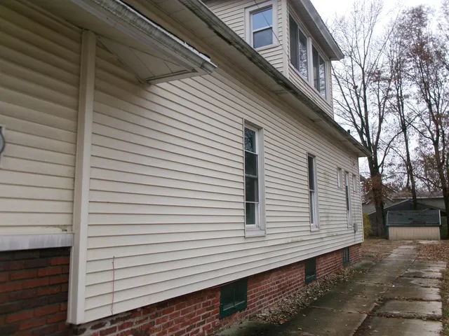 a view of a white house with a large windows