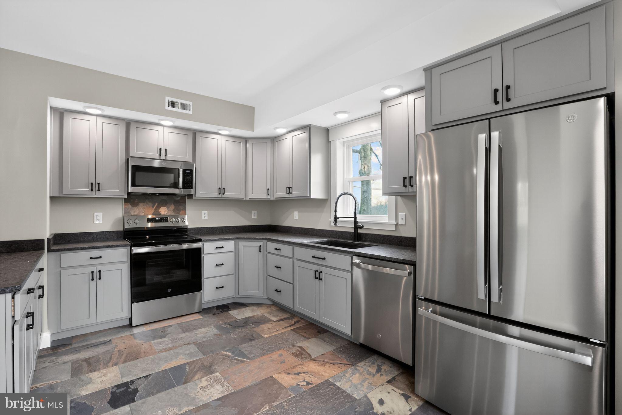 128 Maugers Mill Road Pottstown, PA 19464 - Photo 13 of 42 Sleek modern kitchen with stylish finishes.