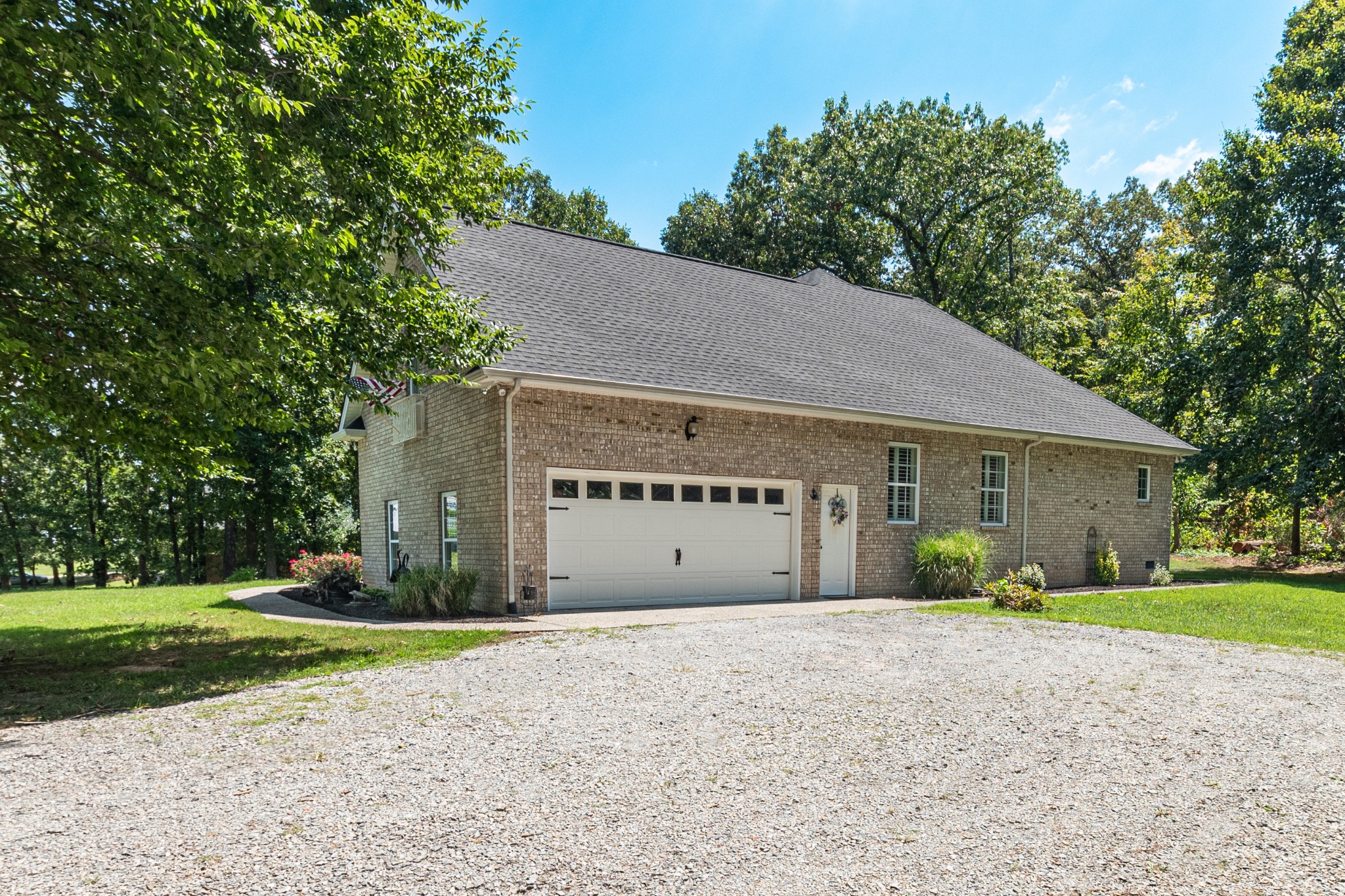 418 Coker Ford Road Portland, TN 37148 - Photo 2 of 38 a front view of a house with garden