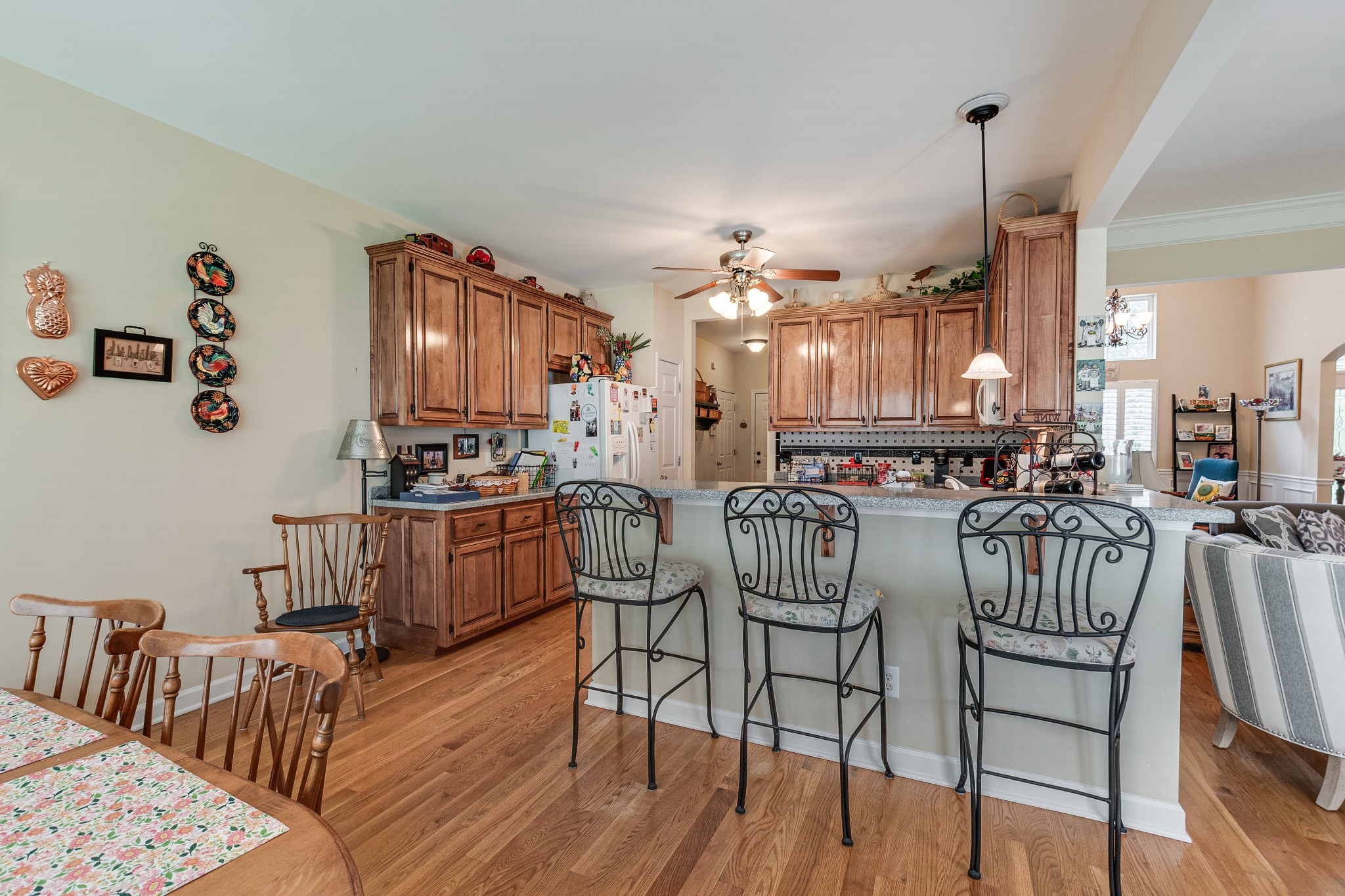 418 Coker Ford Road Portland, TN 37148 - Photo 21 of 38 a kitchen with stainless steel appliances kitchen island granite countertop a table chairs and a refrigerator