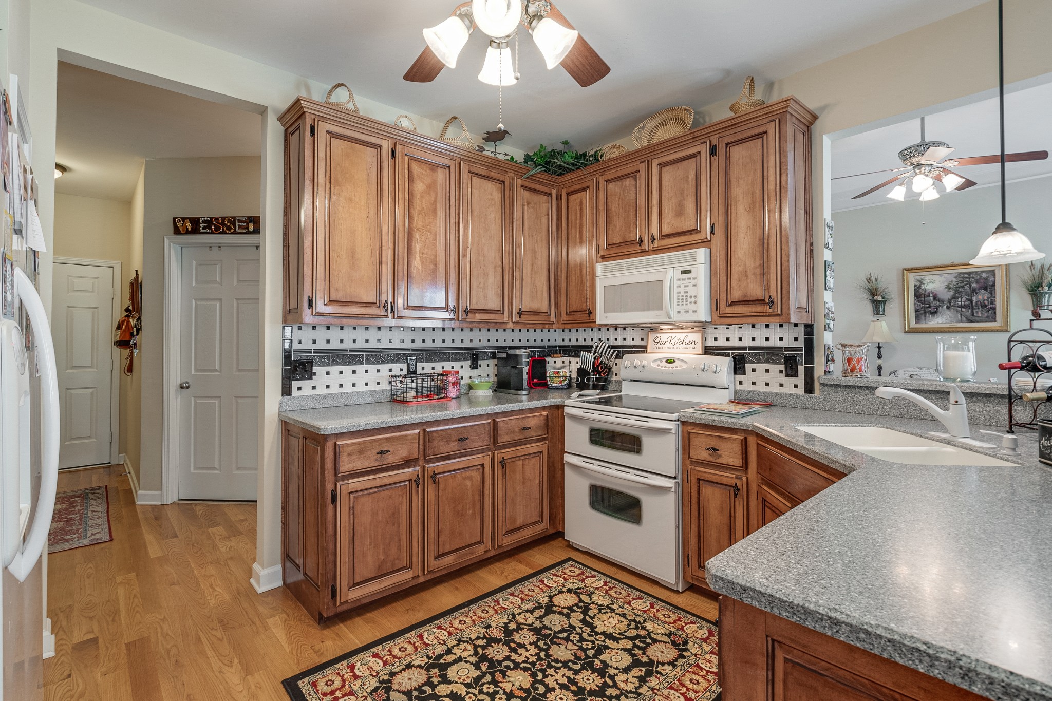 418 Coker Ford Road Portland, TN 37148 - Photo 23 of 38 a kitchen with a stove a sink and a refrigerator