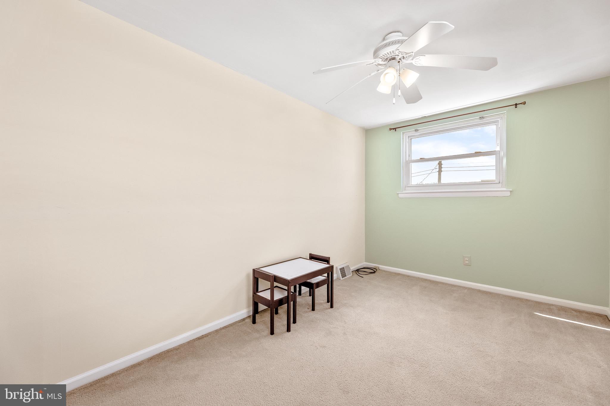 3464 Fitler Street Philadelphia, PA 19114 - Photo 11 of 22 an empty room with a window and a ceiling fan