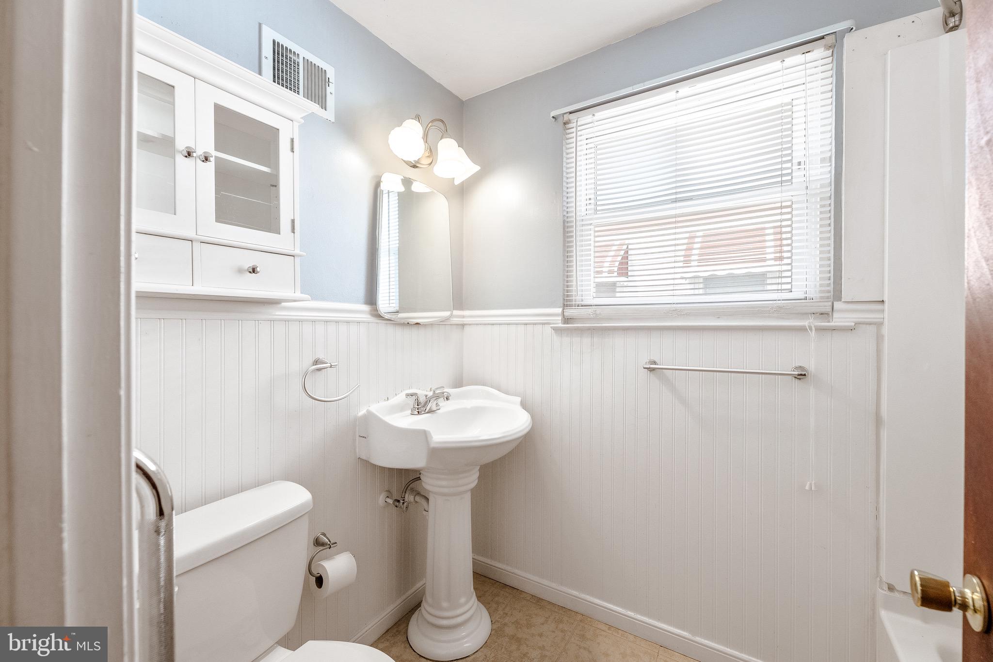 3464 Fitler Street Philadelphia, PA 19114 - Photo 18 of 22 a bathroom with a sink toilet and a mirror