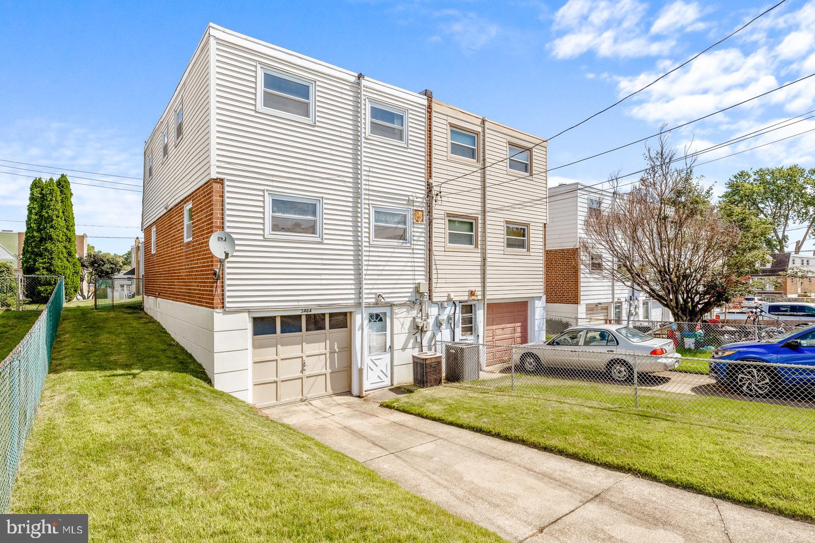 3464 Fitler Street Philadelphia, PA 19114 - Photo 22 of 22 a front view of a house with a yard and garage