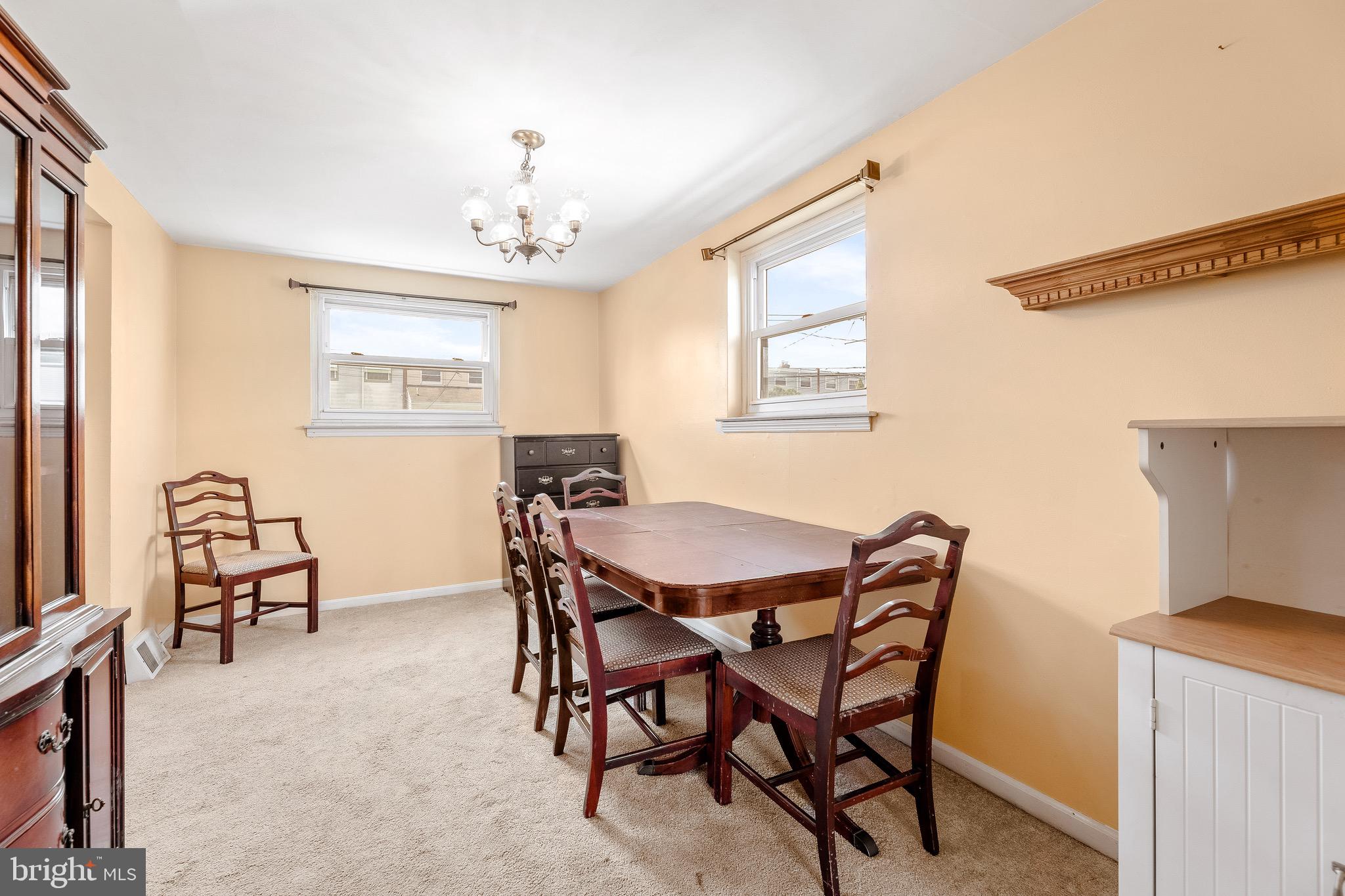 3464 Fitler Street Philadelphia, PA 19114 - Photo 7 of 22 a view of a dining room with furniture and a chandelier