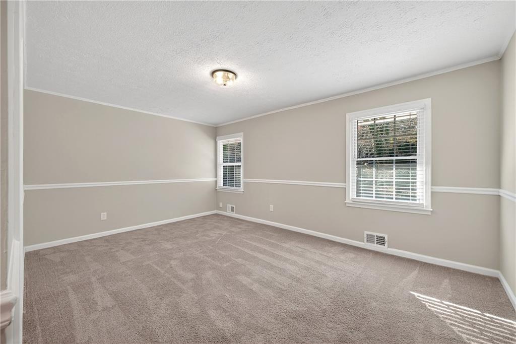 187 Old Timber Road Lawrenceville, GA 30046 - Photo 23 of 32 an empty room with windows