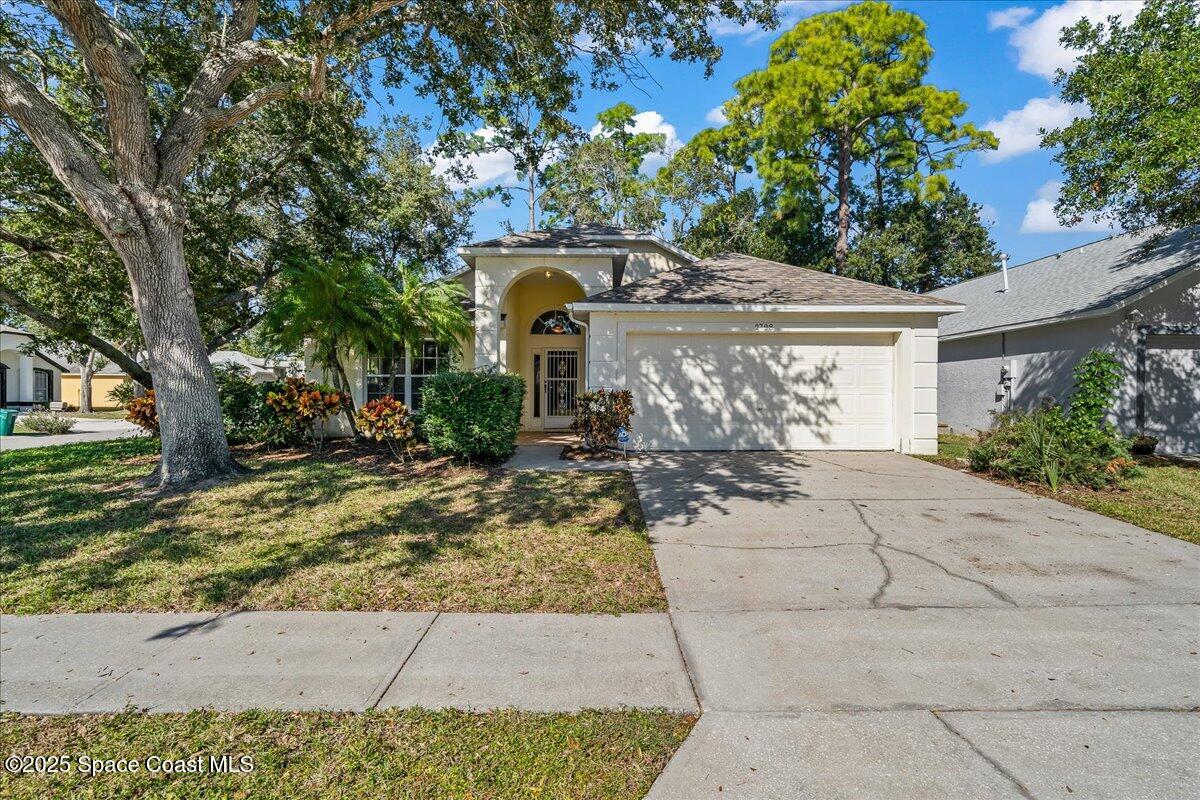 2798 Caitlin Court Melbourne, FL 32940 - Photo 13 of 27 a front view of a house with garden