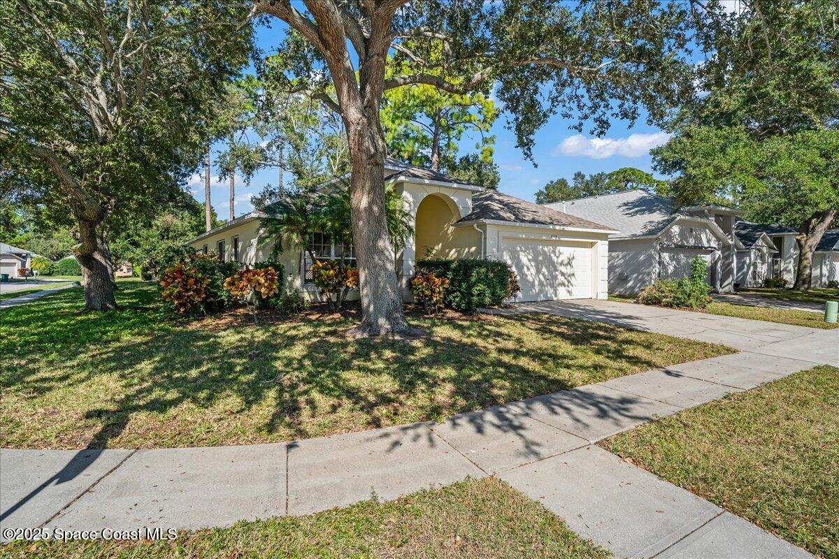 2798 Caitlin Court Melbourne, FL 32940 - Photo 14 of 27 a front view of a house with a yard