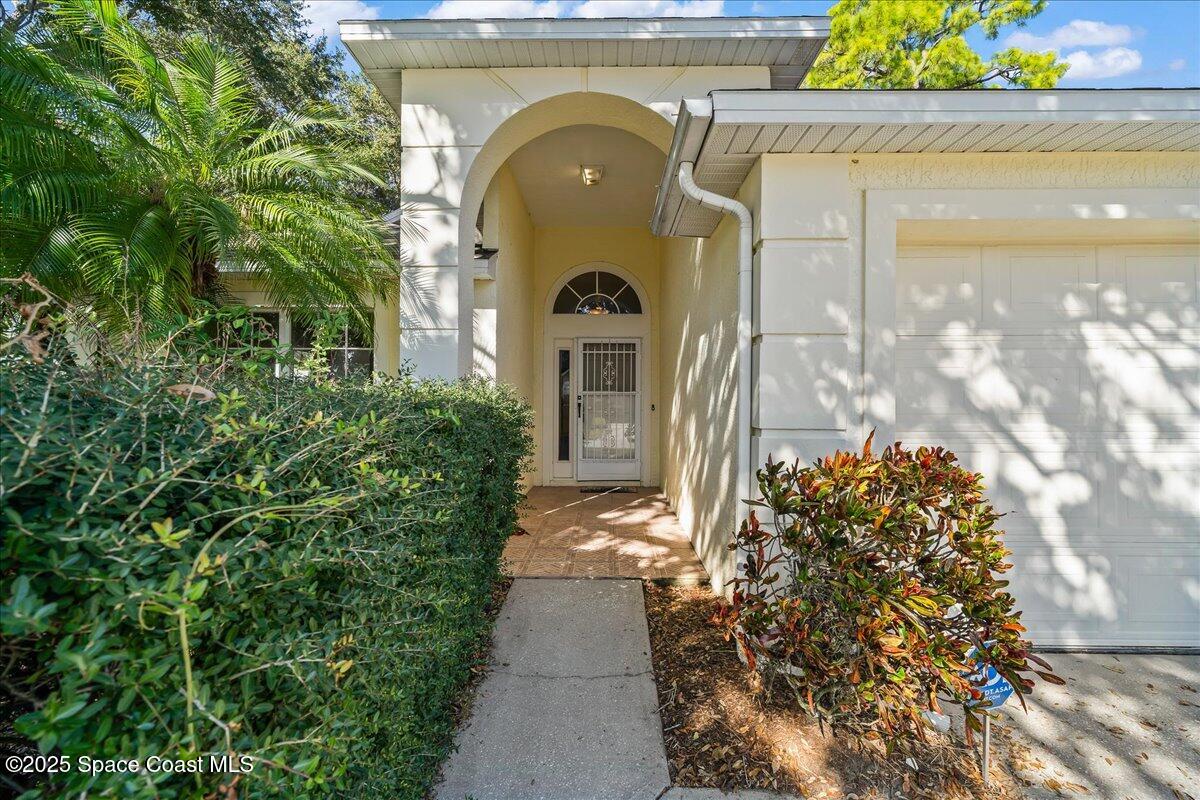 2798 Caitlin Court Melbourne, FL 32940 - Photo 15 of 27 a front view of a house with garden