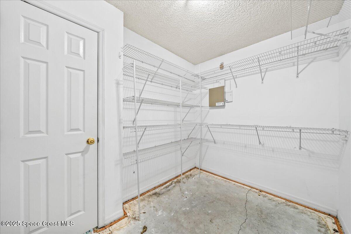 2798 Caitlin Court Melbourne, FL 32940 - Photo 18 of 27 a view of a room with racks on the wall