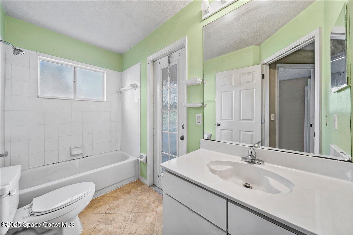 2798 Caitlin Court Melbourne, FL 32940 - Photo 20 of 27 a bathroom with a sink toilet and shower