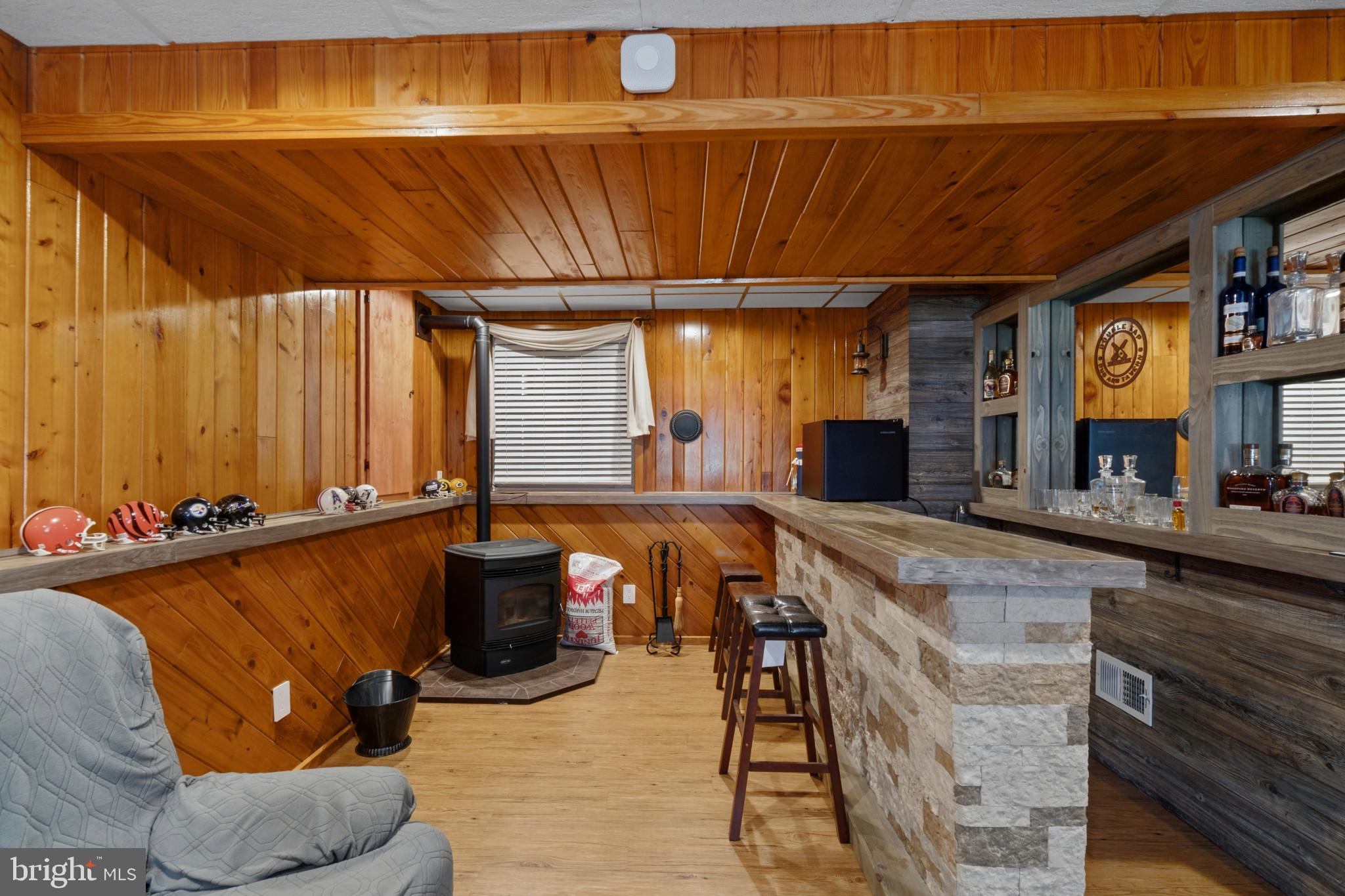 7113 Olivia Road Baltimore, MD 21220 - Photo 10 of 30 Bar and pellet stove