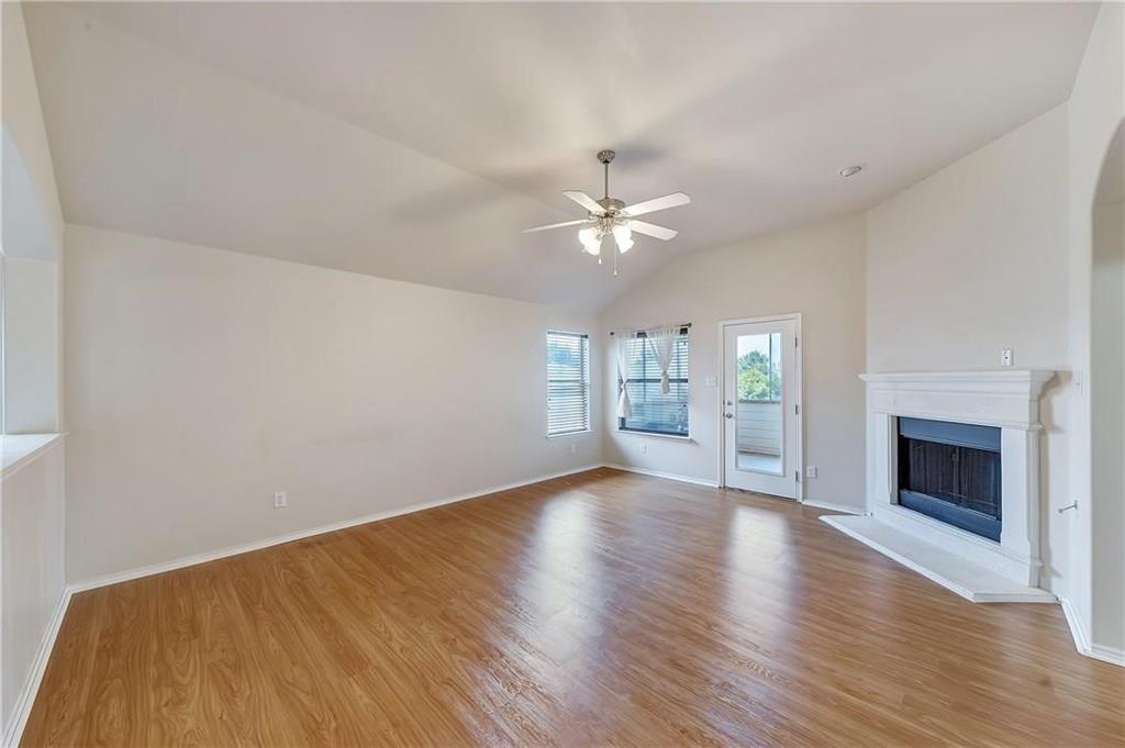 1404 Trading Post Drive Fort Worth, TX 76131 - Photo 13 of 25 a view of an empty room with a fireplace and a window
