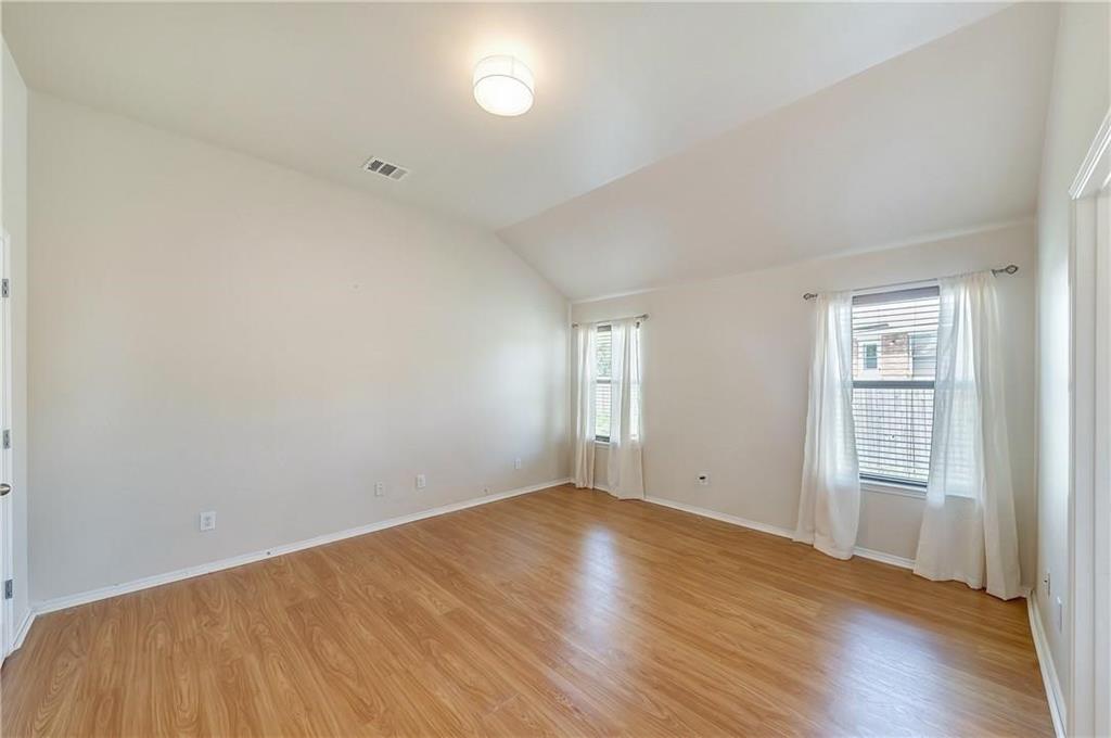 1404 Trading Post Drive Fort Worth, TX 76131 - Photo 14 of 25 an empty room with wooden floor and windows