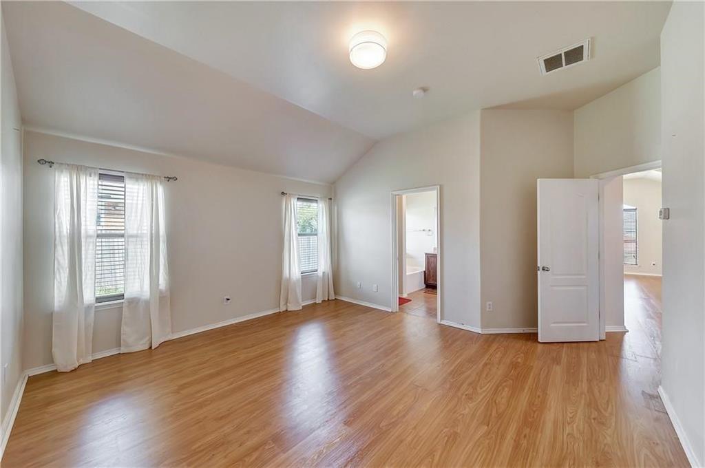 1404 Trading Post Drive Fort Worth, TX 76131 - Photo 15 of 25 an empty room with wooden floor and windows