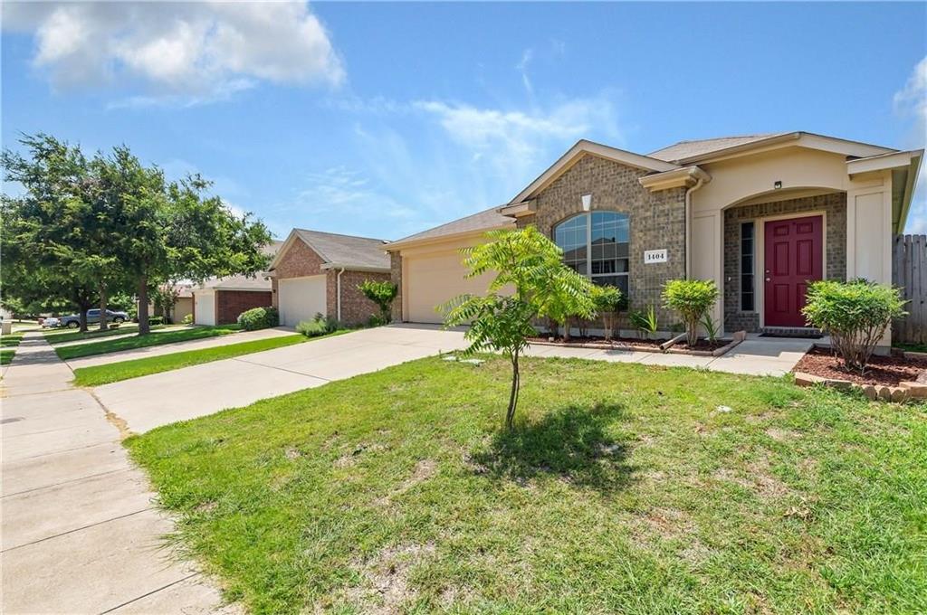 1404 Trading Post Drive Fort Worth, TX 76131 - Photo 2 of 25 a view of a house with a small yard and a large tree