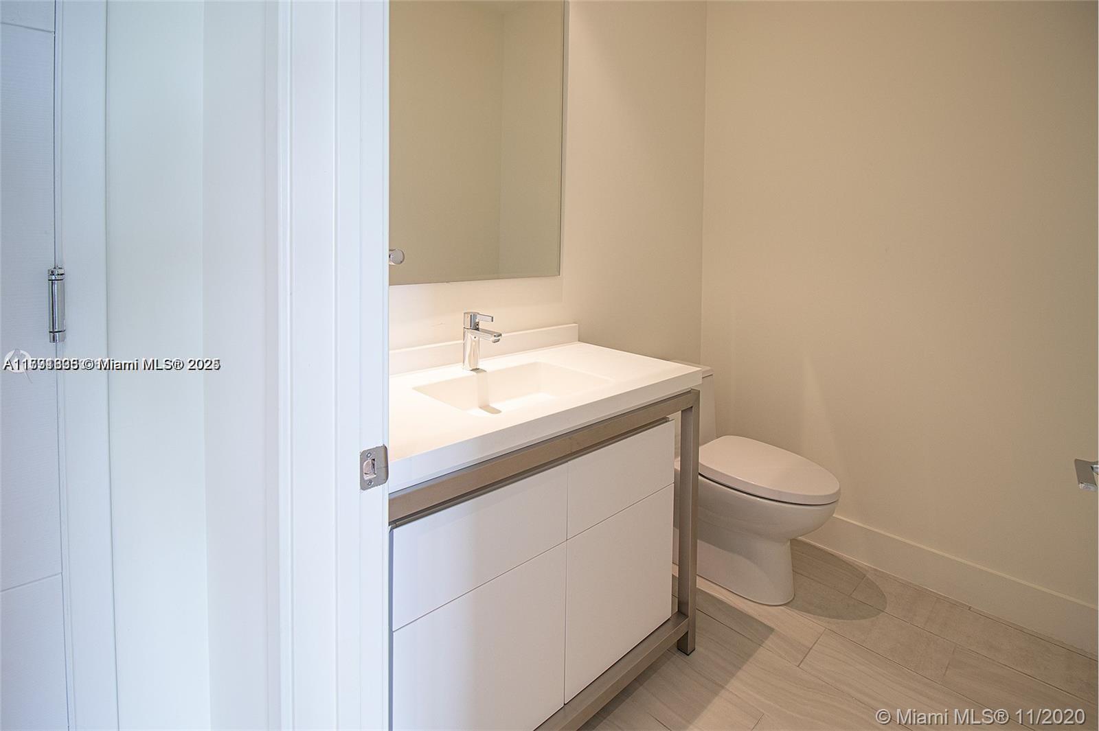 2000 Metropica Way, Unit 614 Sunrise, FL 33323 - Photo 5 of 18 a bathroom with a sink and a toilet