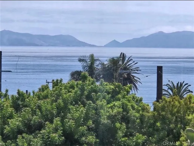 a view of a house with a yard and a large window