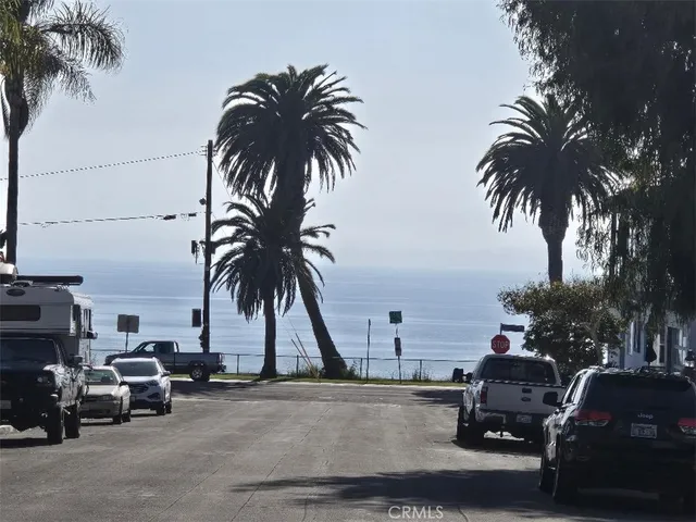 a view of a street with cars