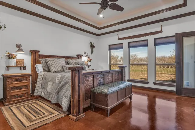 a spacious bathroom with a granite countertop sink a mirror and a bathtub