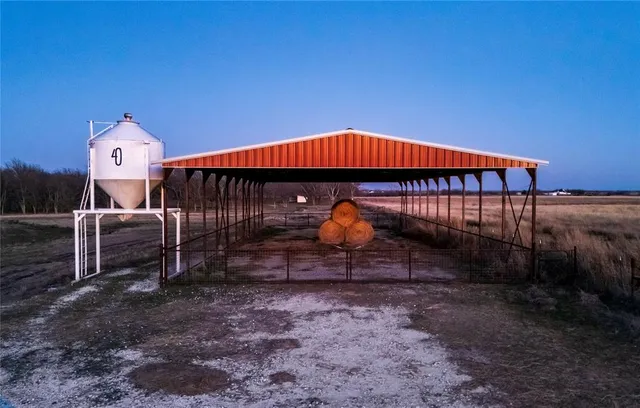 a view of a big house with a big yard