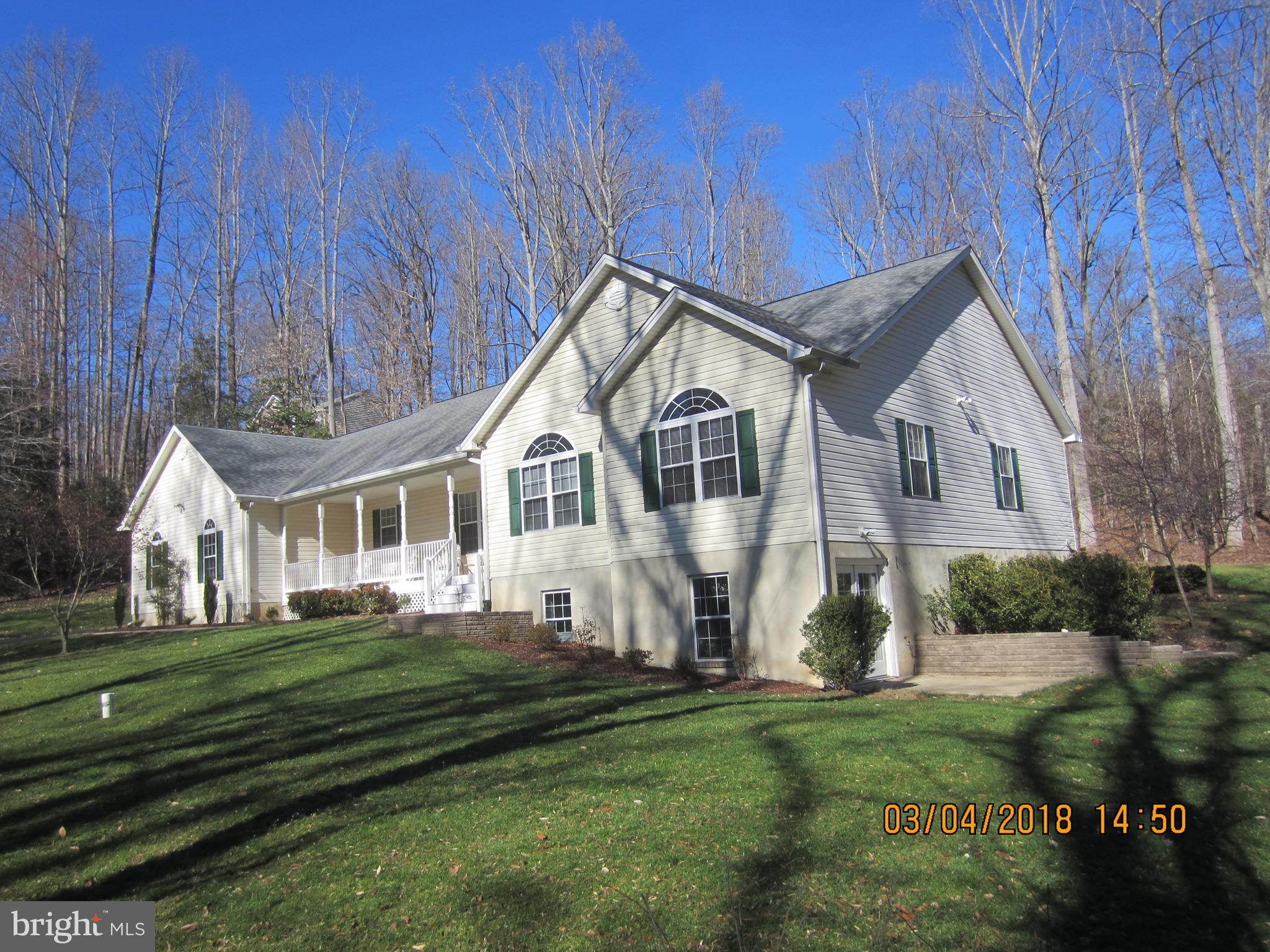 3535 Yellow Bank Road Dunkirk, MD 20754 - Photo 2 of 25 a front view of a house with a garden