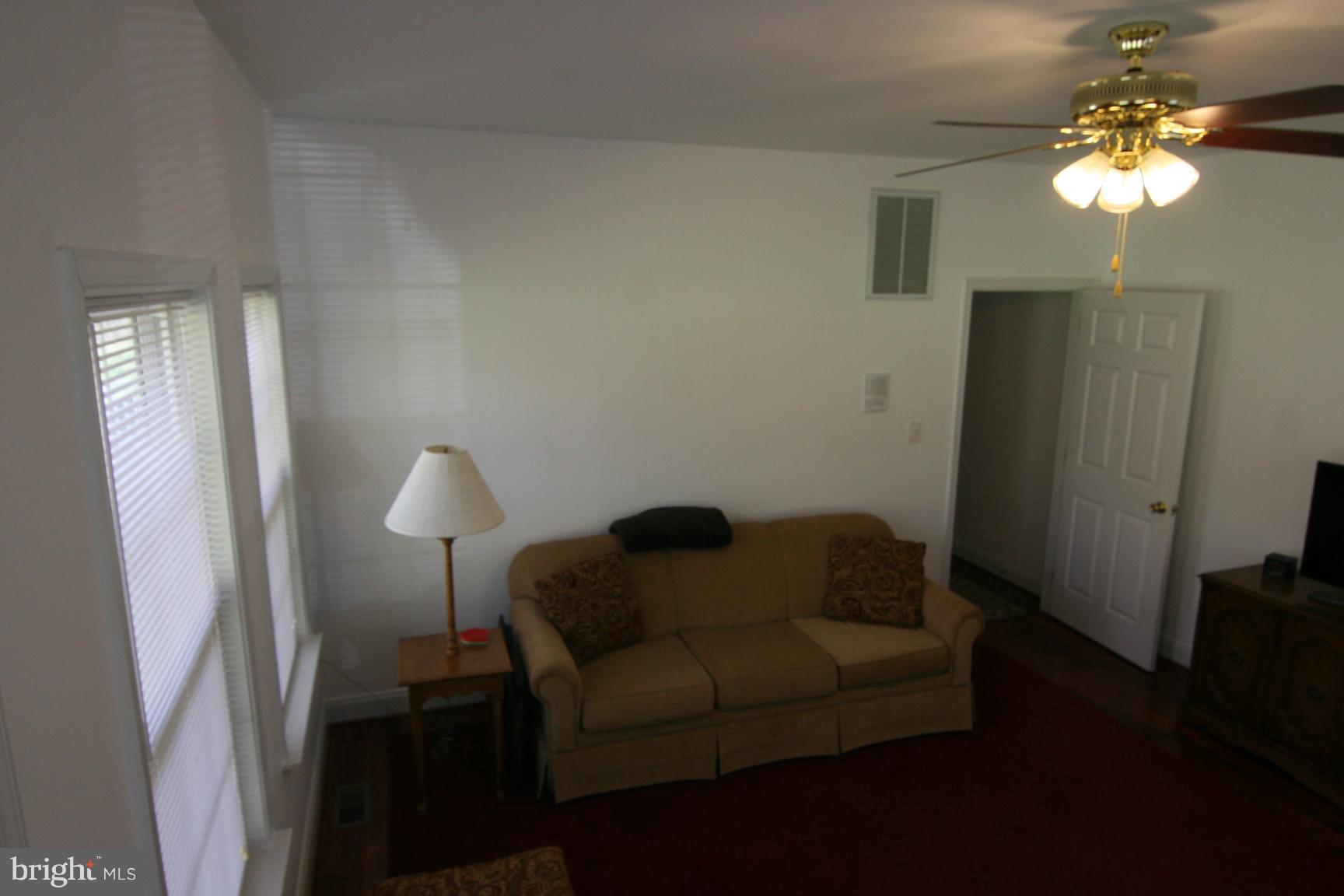 3535 Yellow Bank Road Dunkirk, MD 20754 - Photo 14 of 25 a living room with furniture and a chandelier