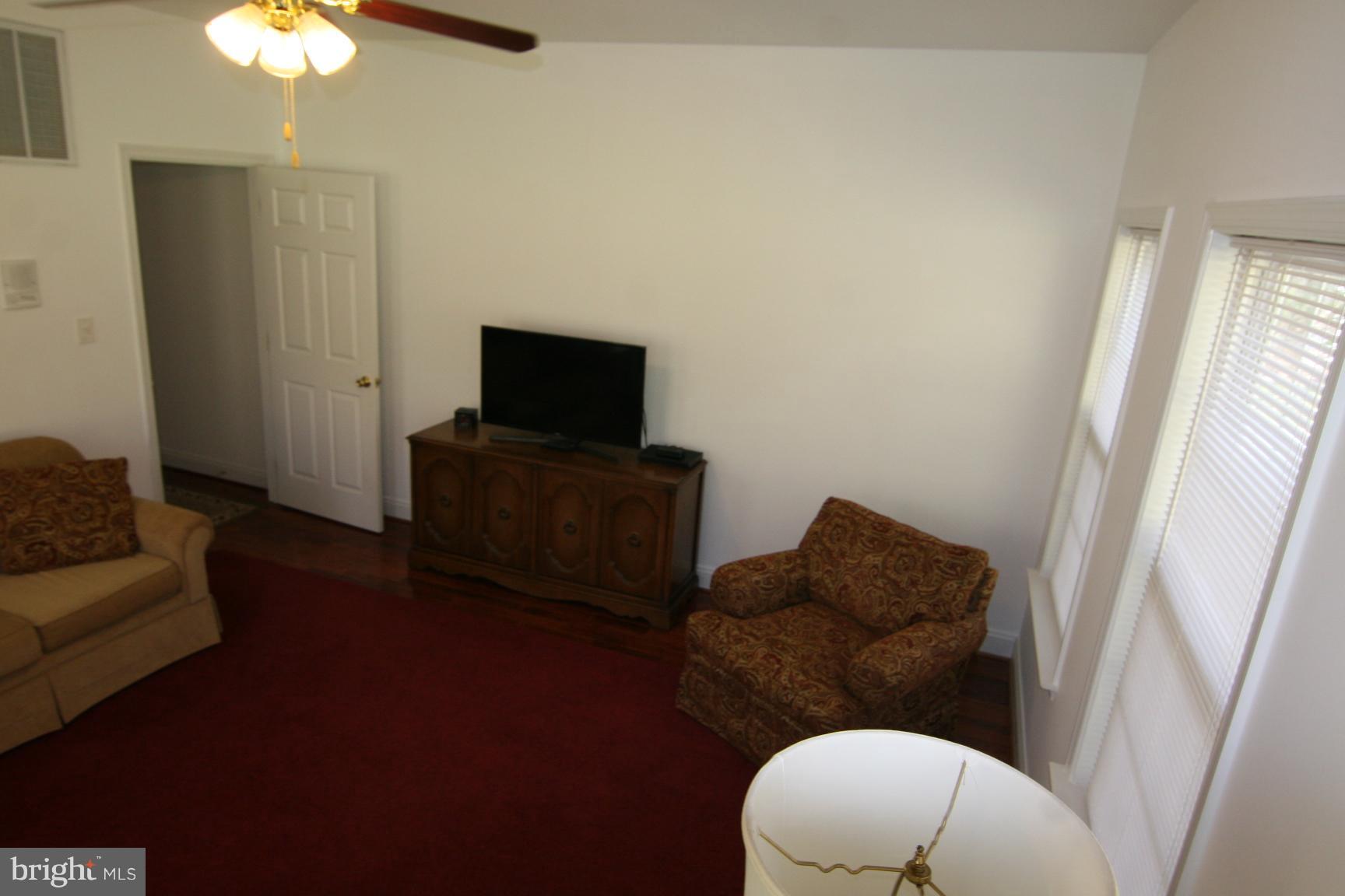 3535 Yellow Bank Road Dunkirk, MD 20754 - Photo 15 of 25 a living room with furniture and a flat screen tv